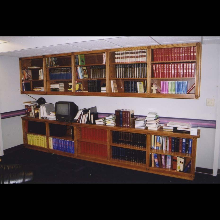 A library with lots of books and a television