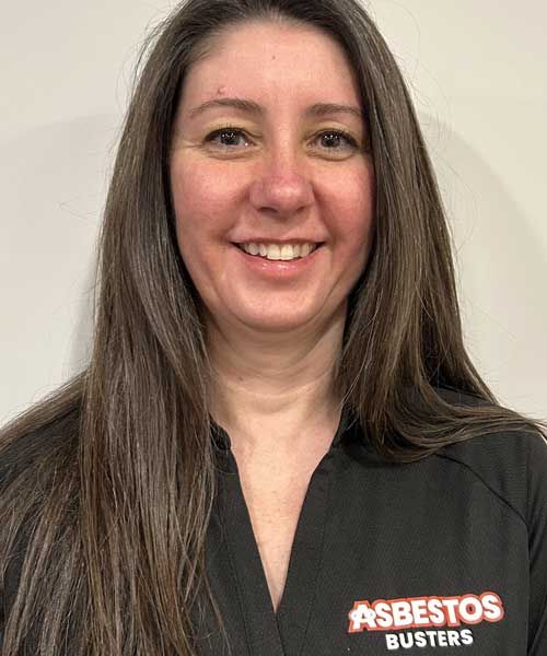 A woman is wearing a black shirt that says asbestos busters on it.