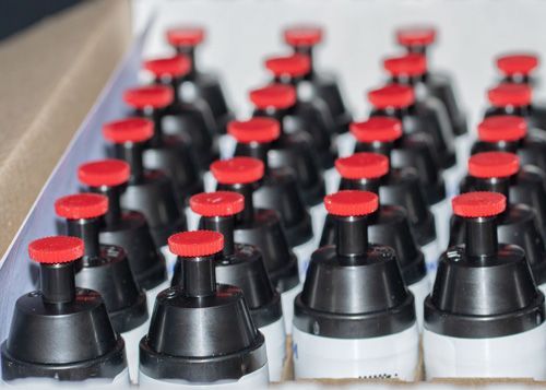 a petri dish filled with a white substance on a table