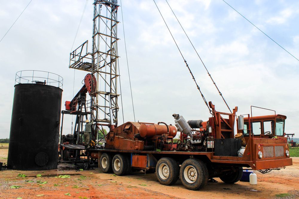 A Truck is Parked in Front of an Oil Rig — Proton Engineering Pty Ltd In Tamworth, NSW