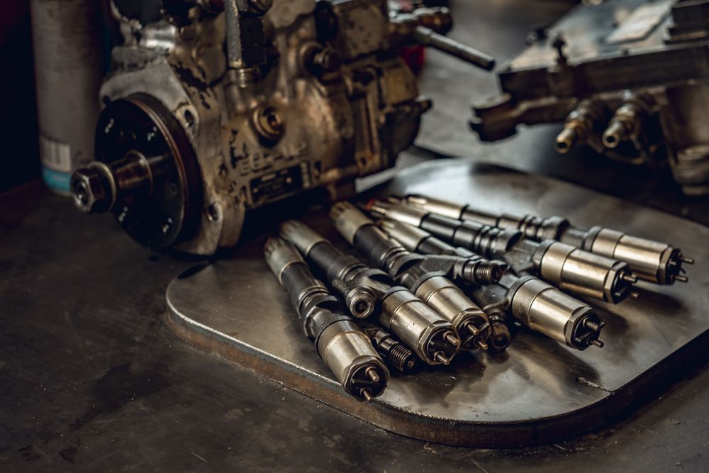 A Gearbox With Some Parts Laying on Top Of a Metal — Proton Engineering Pty Ltd In Wee Waa, NSW