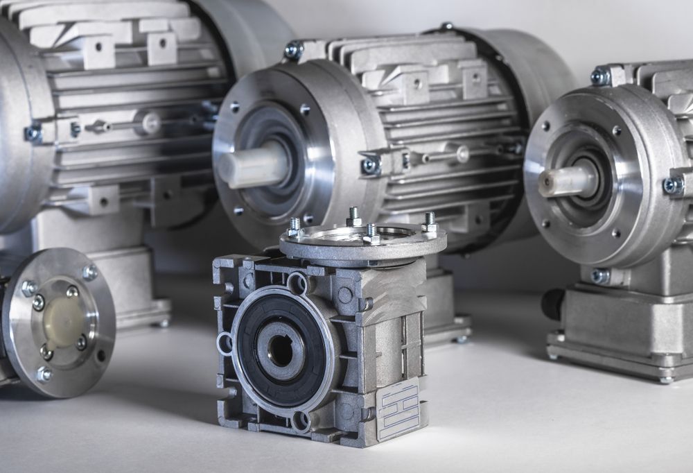 A Group of Motors and Gearboxes Are Sitting on a Table — Proton Engineering Pty Ltd In Moree, NSW
