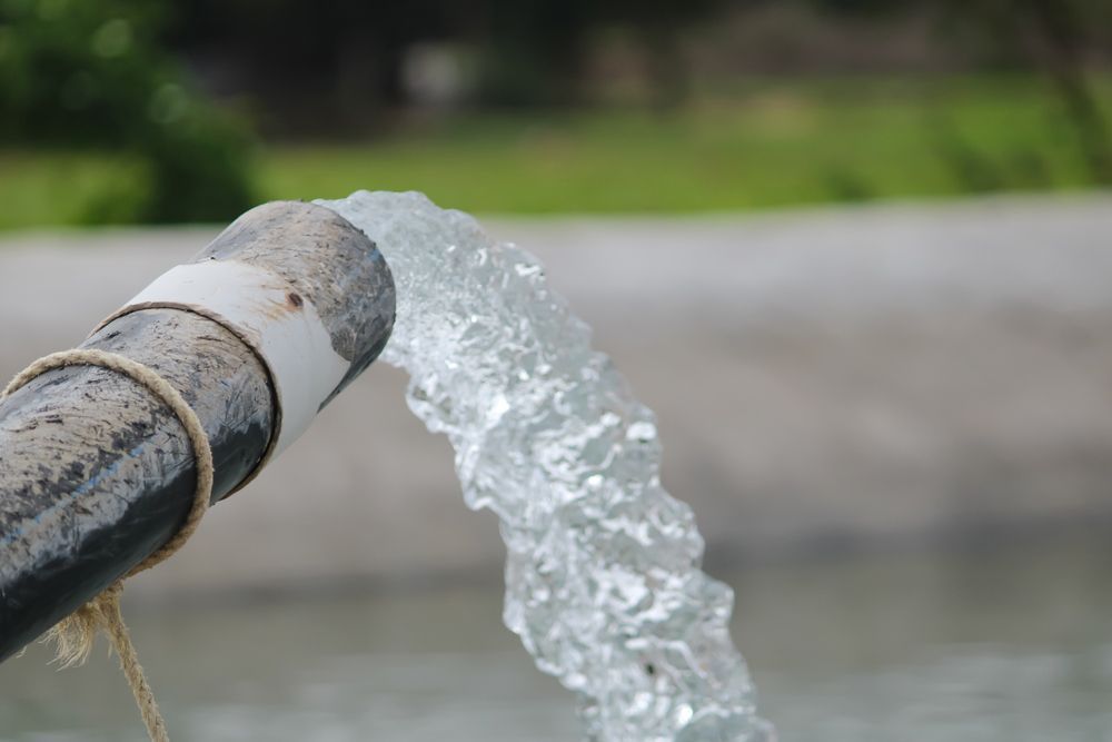 A Close Up of a Pipe With Water Coming Out of It — Proton Engineering Pty Ltd In Narrabri, NSW