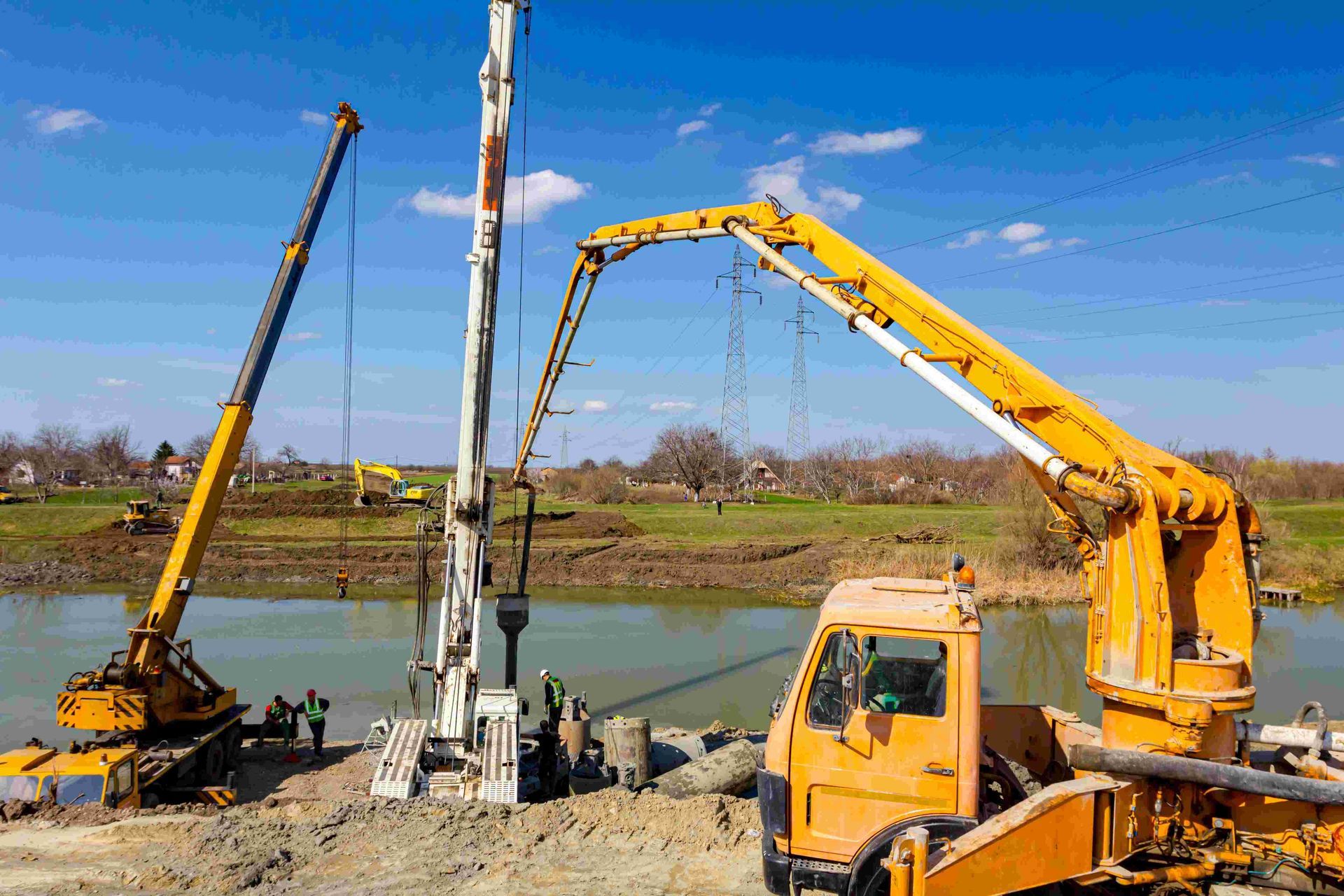 A Concrete Pump is Being Used to Pump Concrete Into a River — Proton Engineering Pty Ltd In Gunnedah, NSW