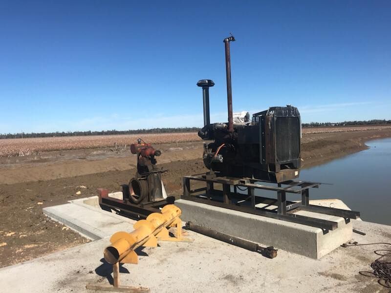 A Machine is Sitting on Top of a Concrete Platform Next to a Body of Water — Proton Engineering Pty Ltd In Narrabri, NSW
