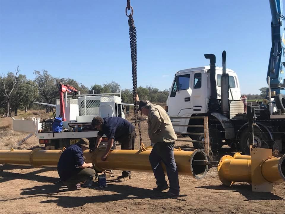 Men Installing Irrigation Pumps — Proton Engineering Pty Ltd In Tamworth, NSW
