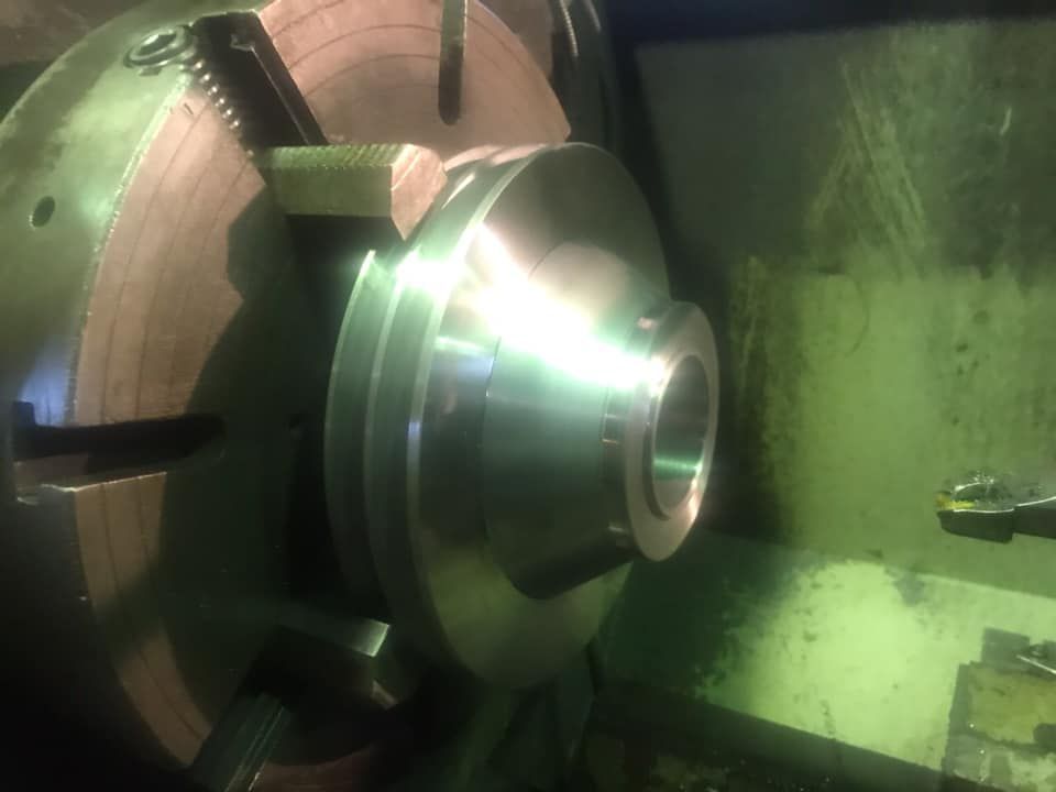 A Piece of Metal is Being Turned on a Lathe — Proton Engineering Pty Ltd In Narrabri, NSW
