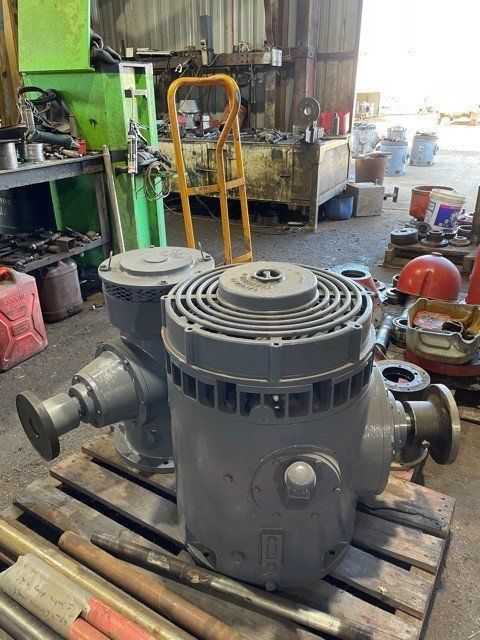A Machine is Sitting on a Wooden Pallet in a Garage — Proton Engineering Pty Ltd In Wee Waa, NSW