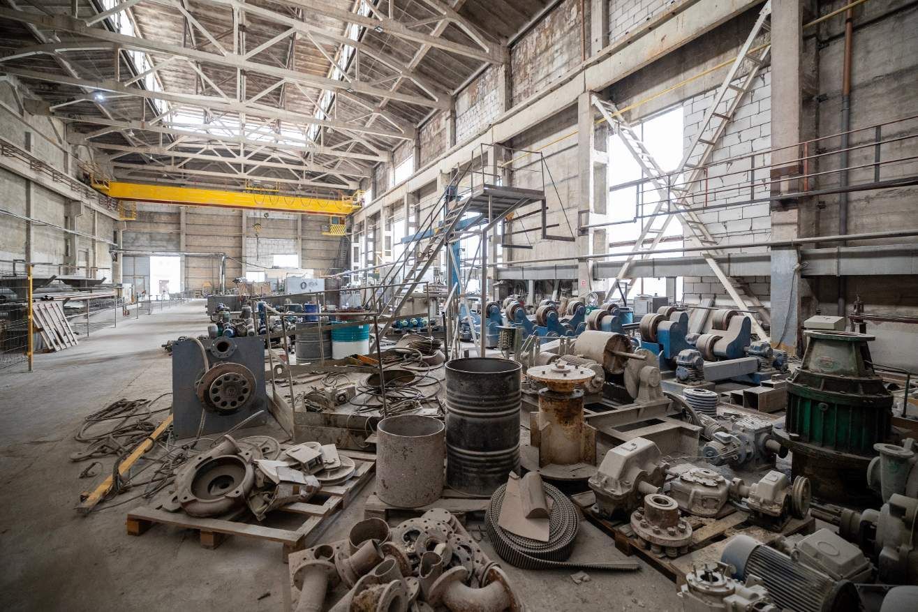 A Large Warehouse Filled With Lots of Junk and Machinery — Proton Engineering Pty Ltd In Gunnedah, NSW