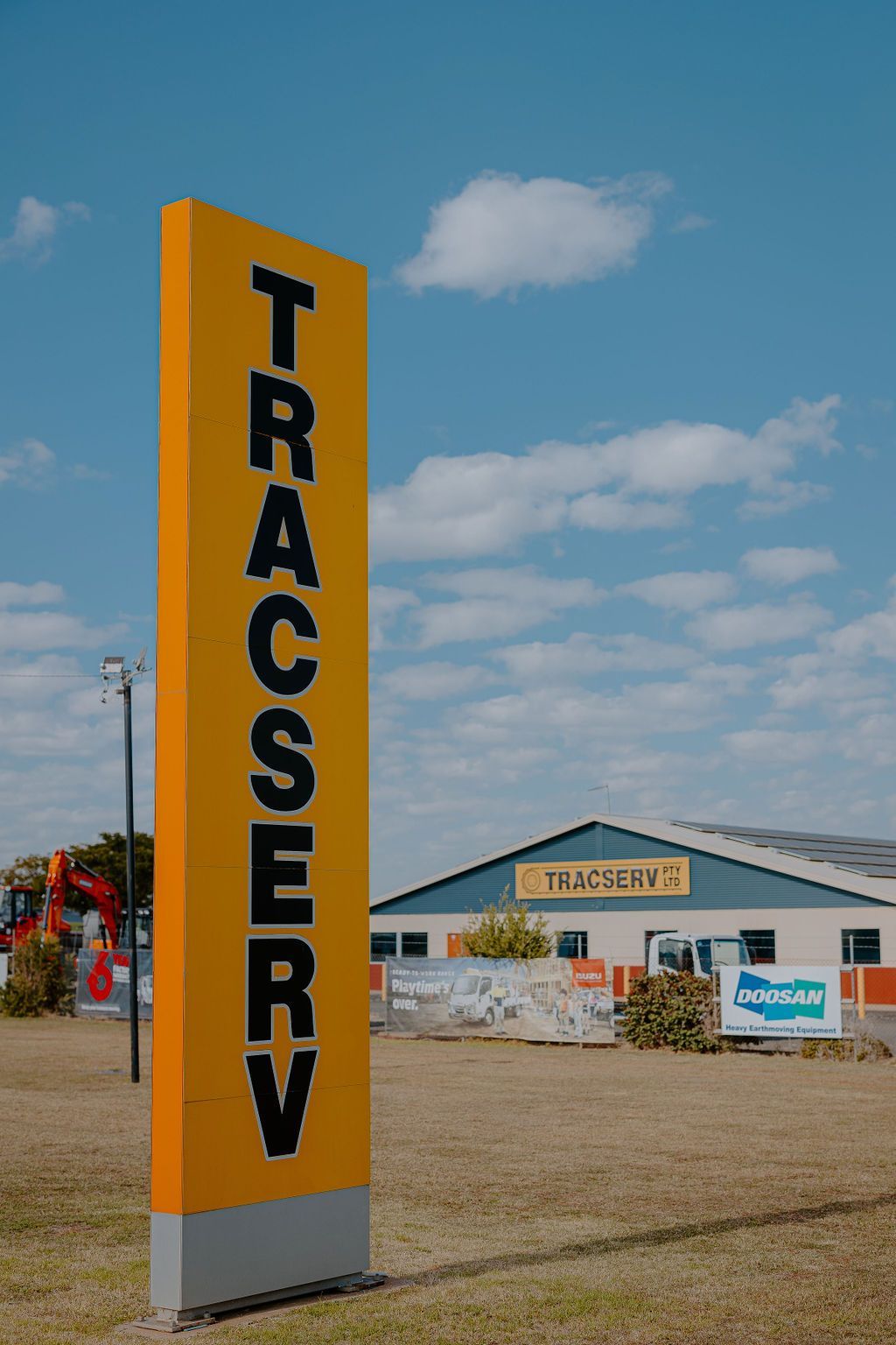 A Yellow Sign That Says Tracserv Is In Front Of A Building — Tracserv in Dubbo, NSW