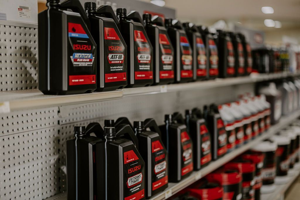 A Shelf Filled With Lots Of Bottles Of Oil In A Store — Tracserv in Dubbo, NSW