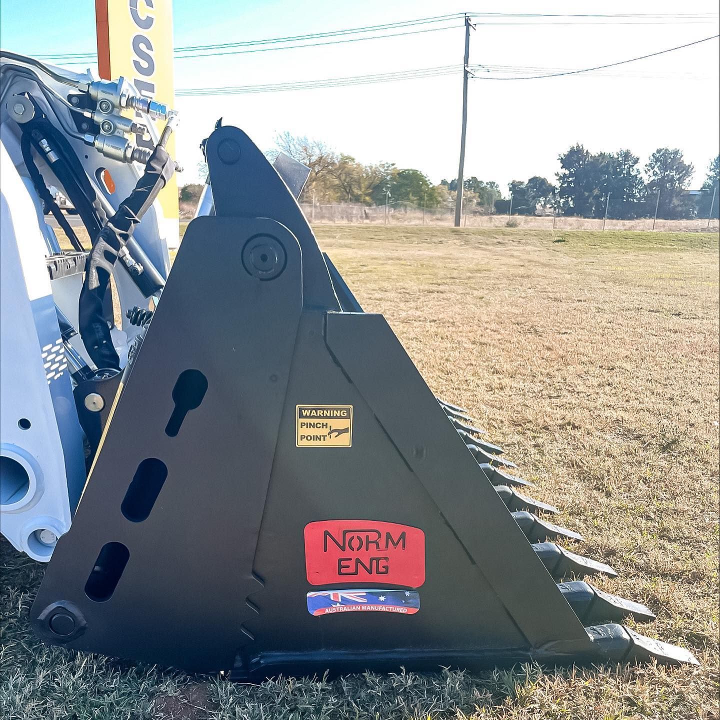 A Black PArt Of Tractor With A Red Label — Tracserv in Forbes, NSW