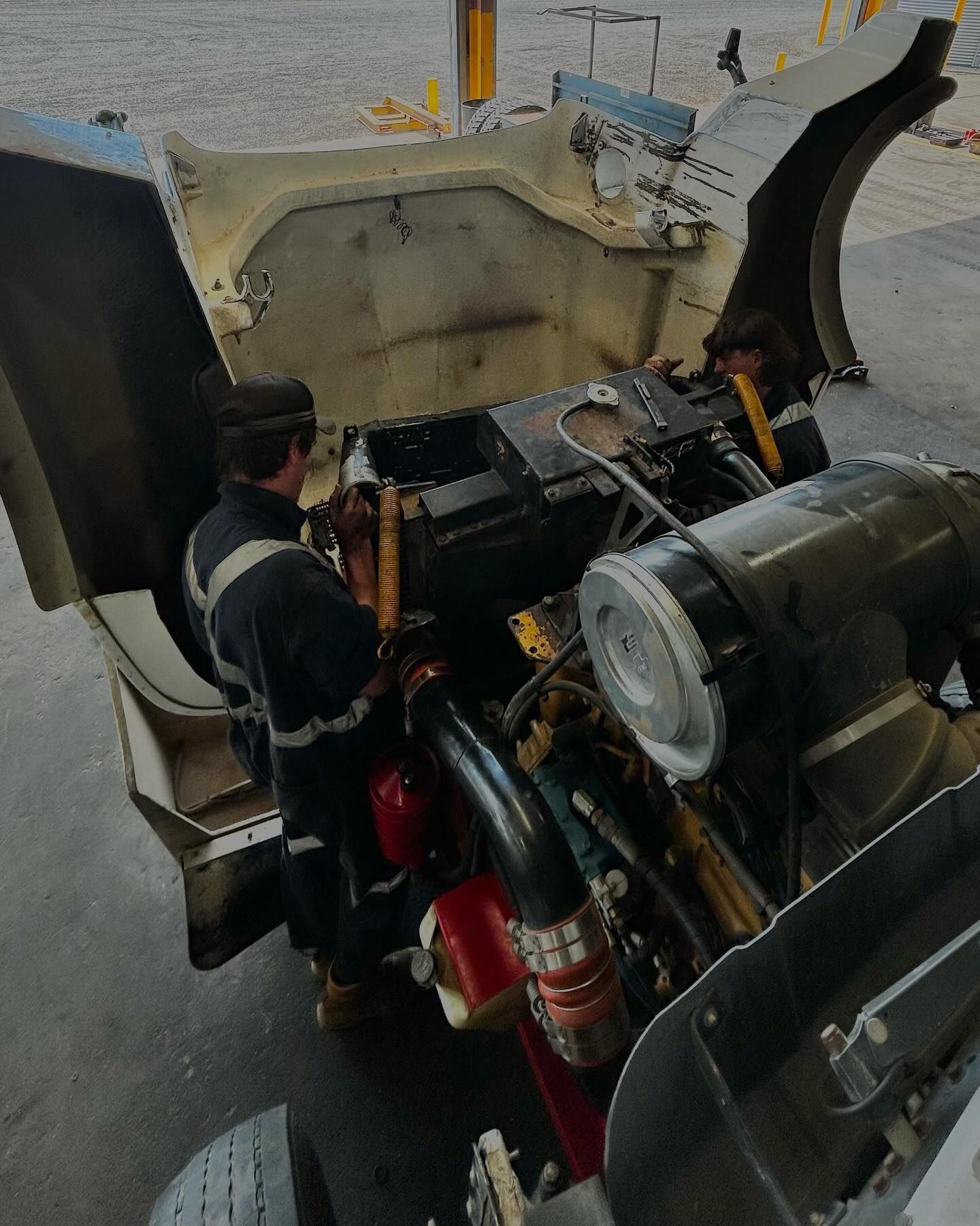 A Man Is Working On The Engine Of A Vehicle — Tracserv in Mudgee, NSW