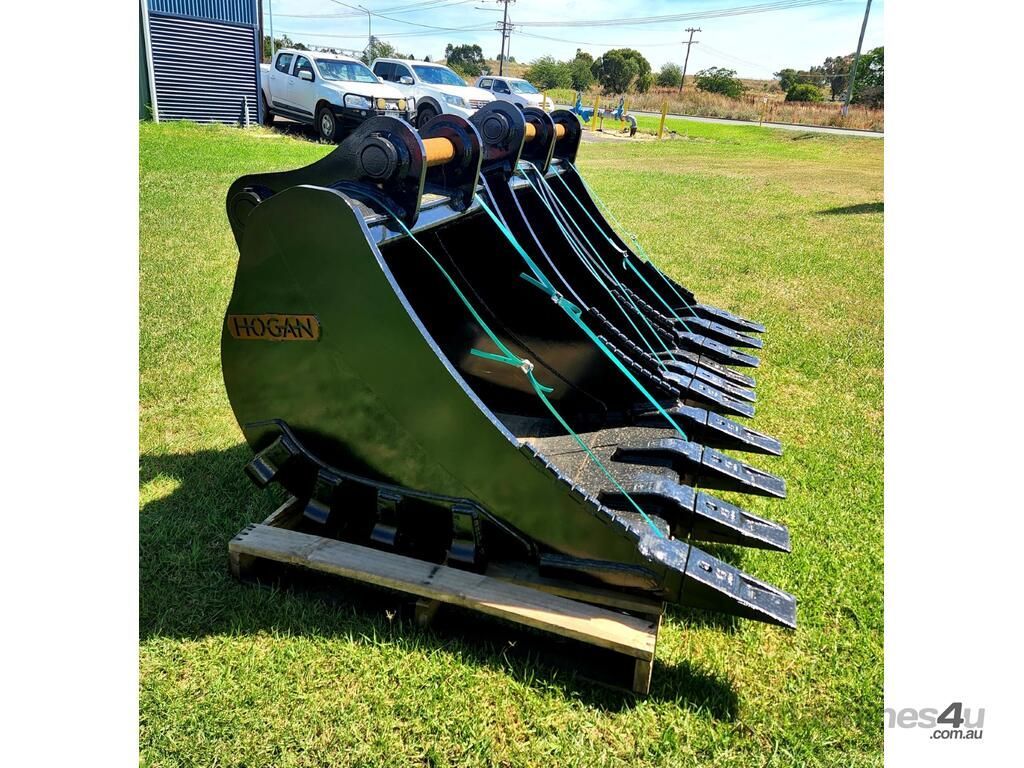 Black Excavator Bucket Attachment Resting on a Wooden Pallet — Tracserv in Dubbo, NSW