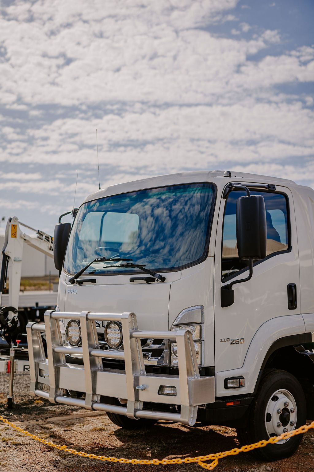 A White Truck Is Parked Next To A Chain Link Fence — Tracserv in Dubbo, NSW