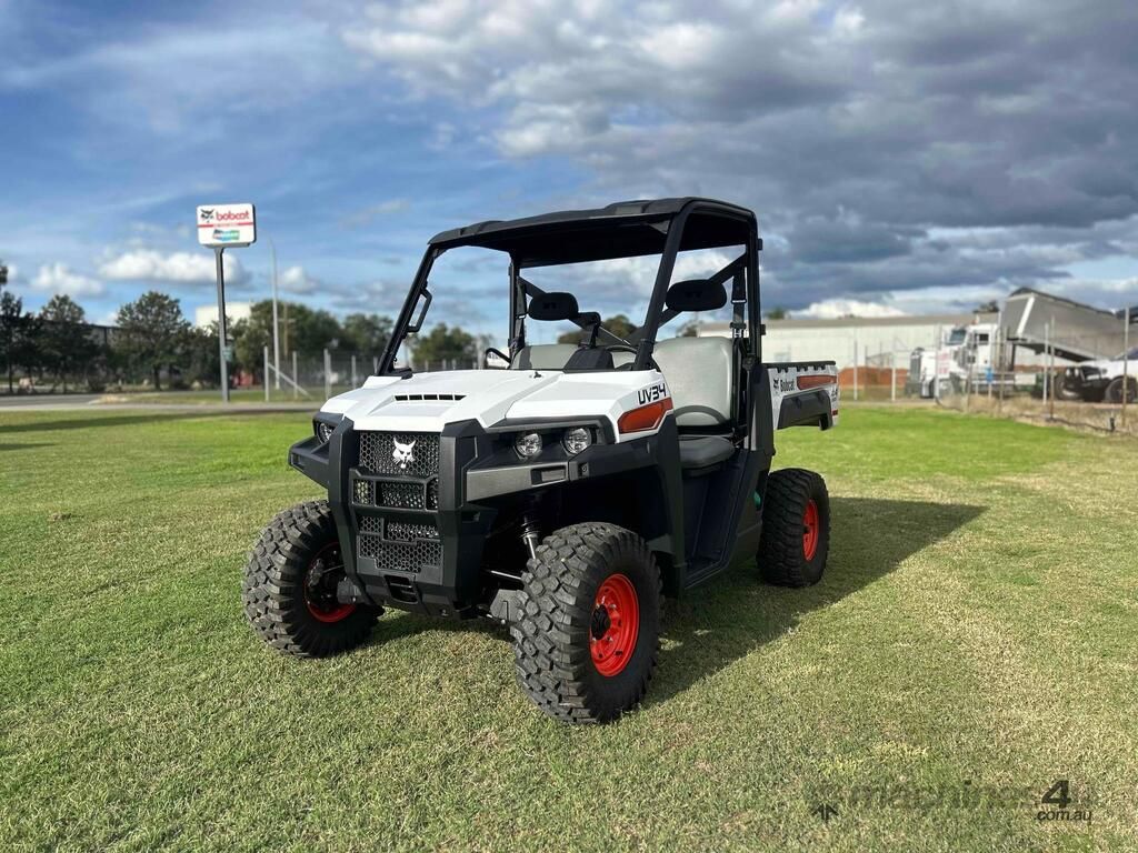 White And Black Utility Side-by-side Atv With Red Wheels — Tracserv in Dubbo, NSW
