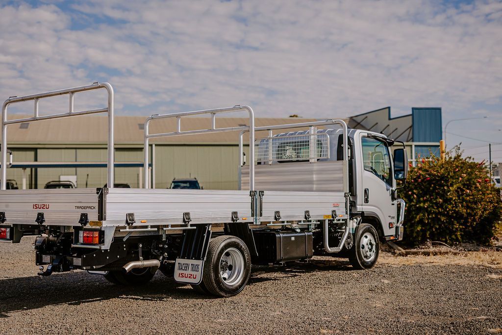 A Truck Is Parked In A Gravel Lot In Front Of A Building — Tracserv in Orange, NSW