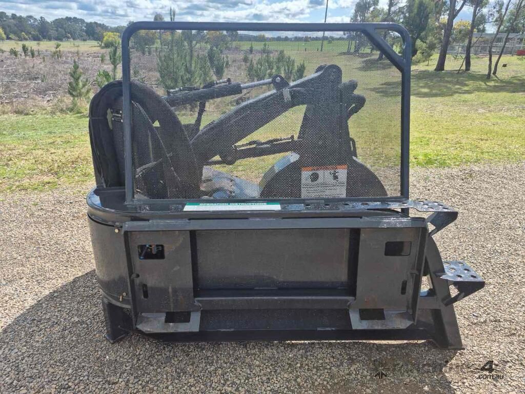 Black Skid Steer Loader With Cab Guard Parked on Gravel — Tracserv in Dubbo, NSW