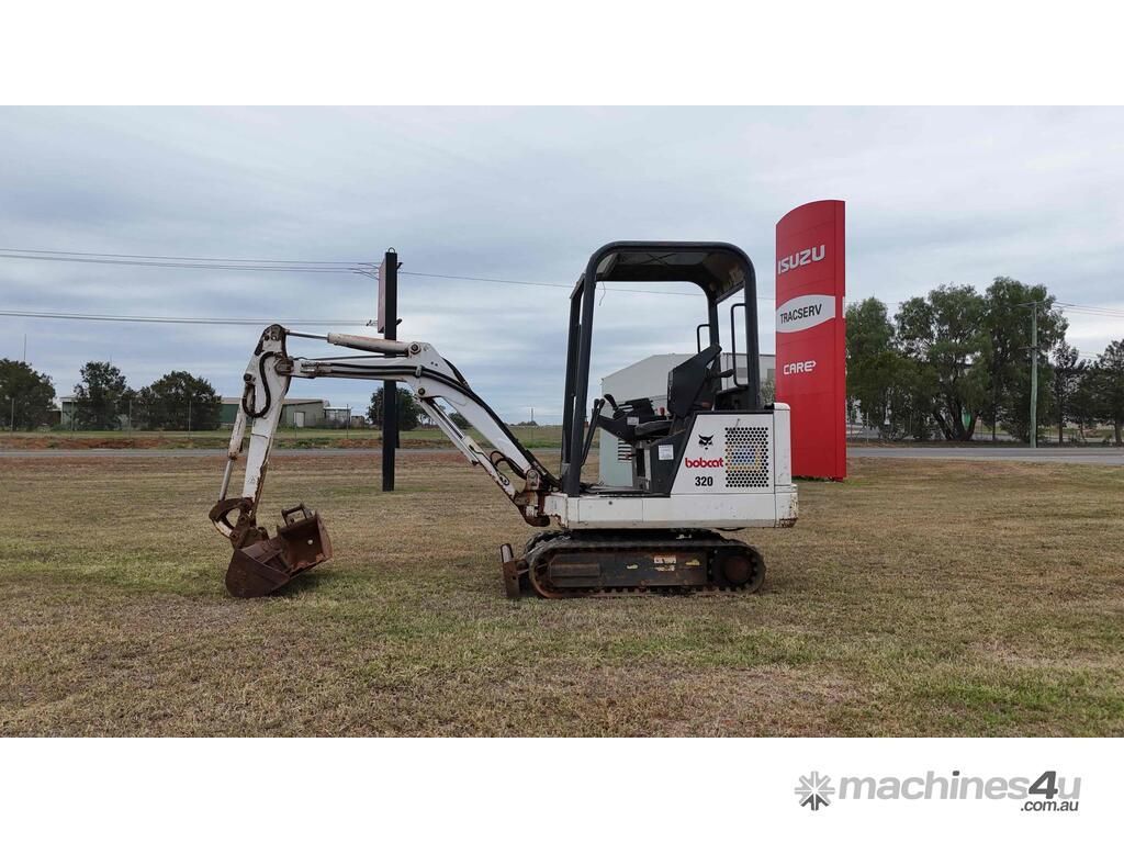 White Mini Excavator With a Grapple Attachment — Tracserv in Dubbo, NSW