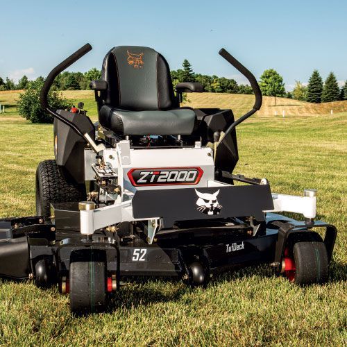 White and black Bobcat ZT2000 zero-turn mower on grass. It has a 52-inch deck.