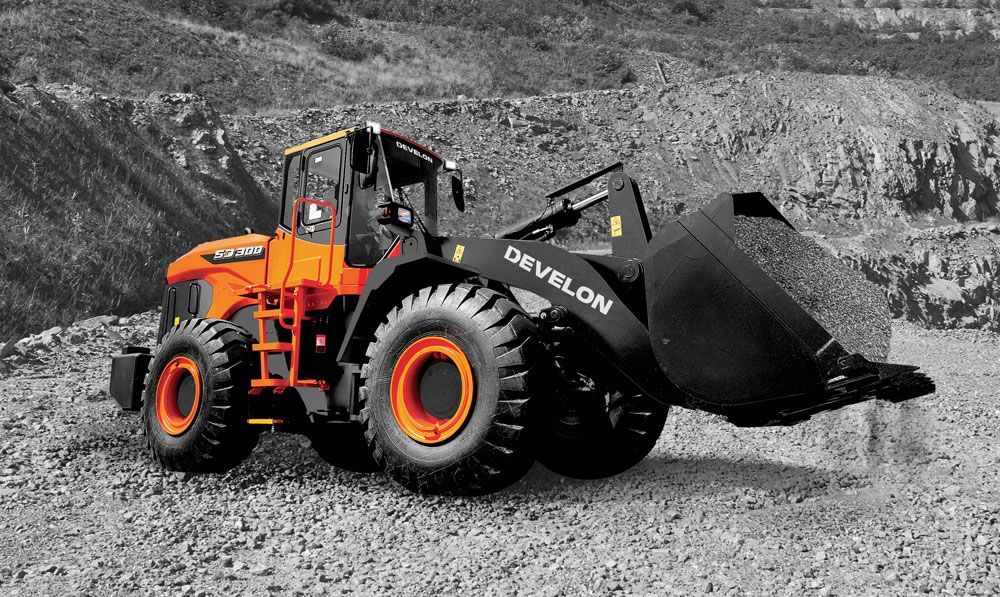 A Black And White Photo Of A Bulldozer On A Gravel Road — Tracserv in Dubbo, NSW