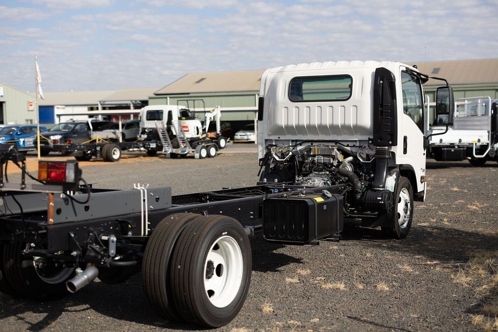 A White Truck Is Parked In A Gravel Lot — Tracserv in Bourke, NSW