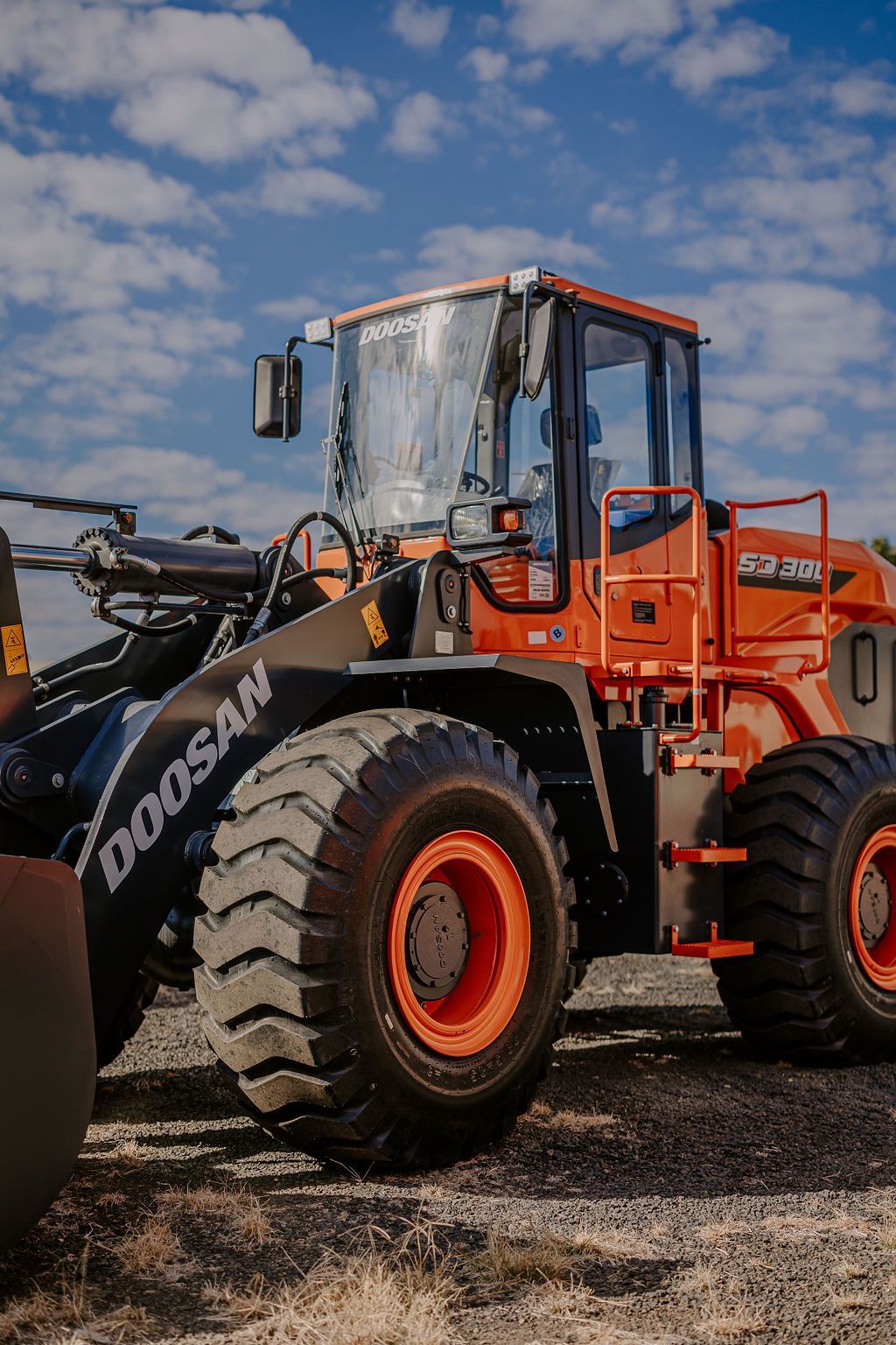 A Doosan Wheel Loader Is Parked In A Field — Tracserv in Orange, NSW