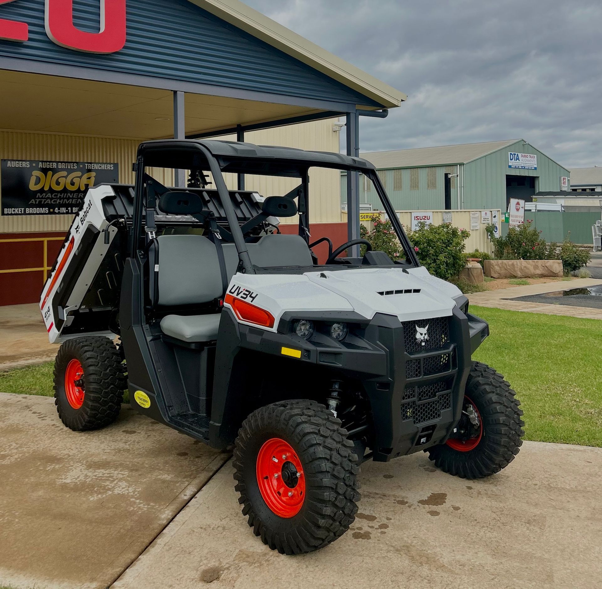 A utility vehicle is parked in front of a building