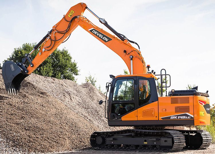 A Large Orange Excavator Is Sitting On Top Of A Pile Of Dirt — Tracserv in Dubbo, NSW