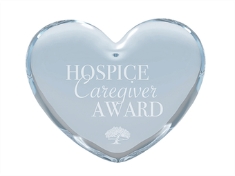 a heart shaped plaque that says hospice caregiver award