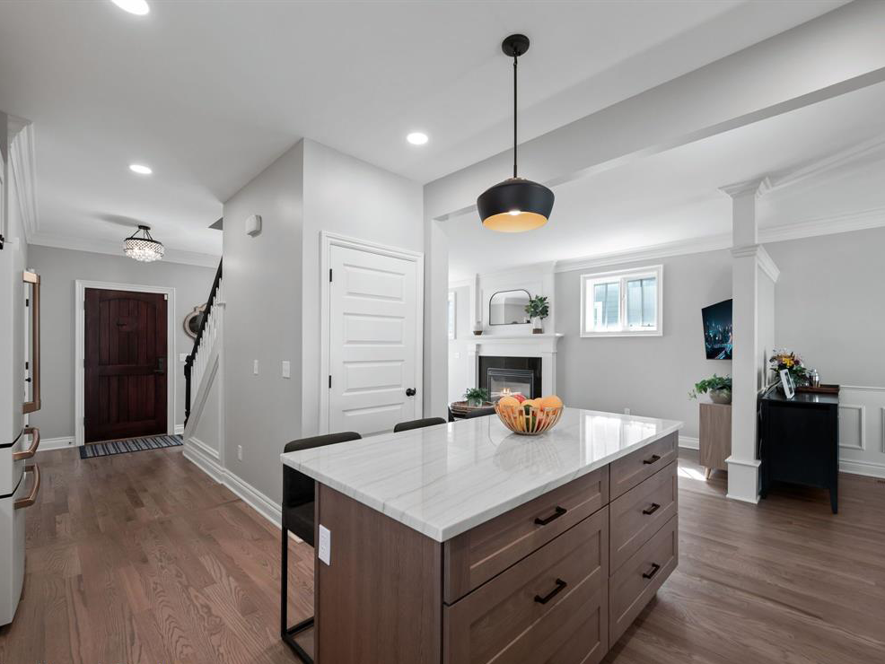 A kitchen with a large island in the middle of the room.