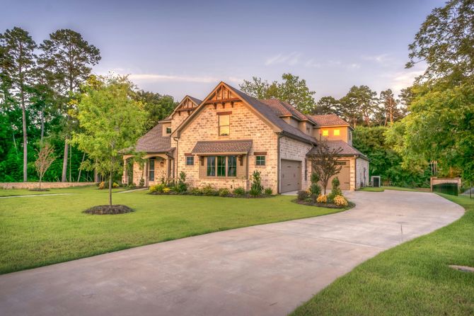 A large house with a driveway leading to it