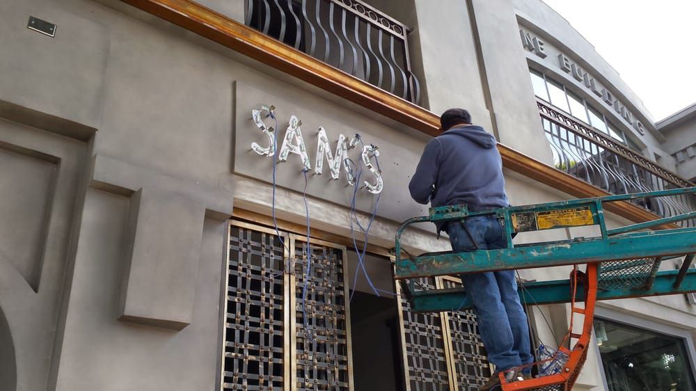 Man on lift installing