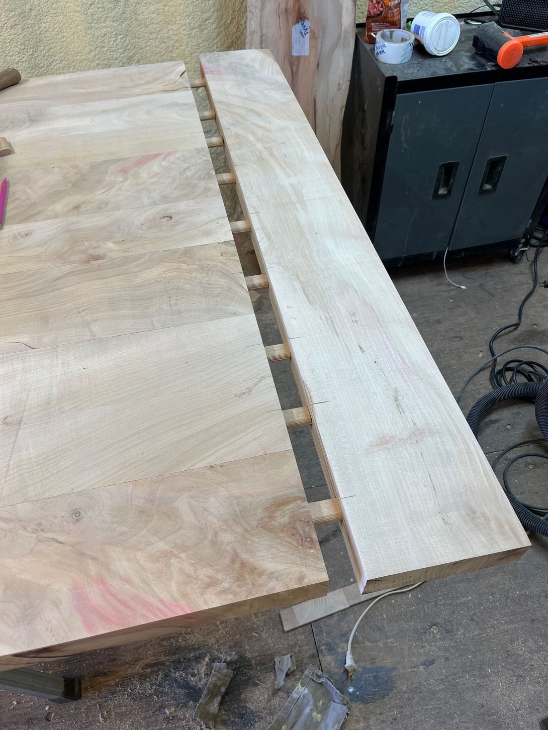 Wooden boards joined with interlocking wood pieces.