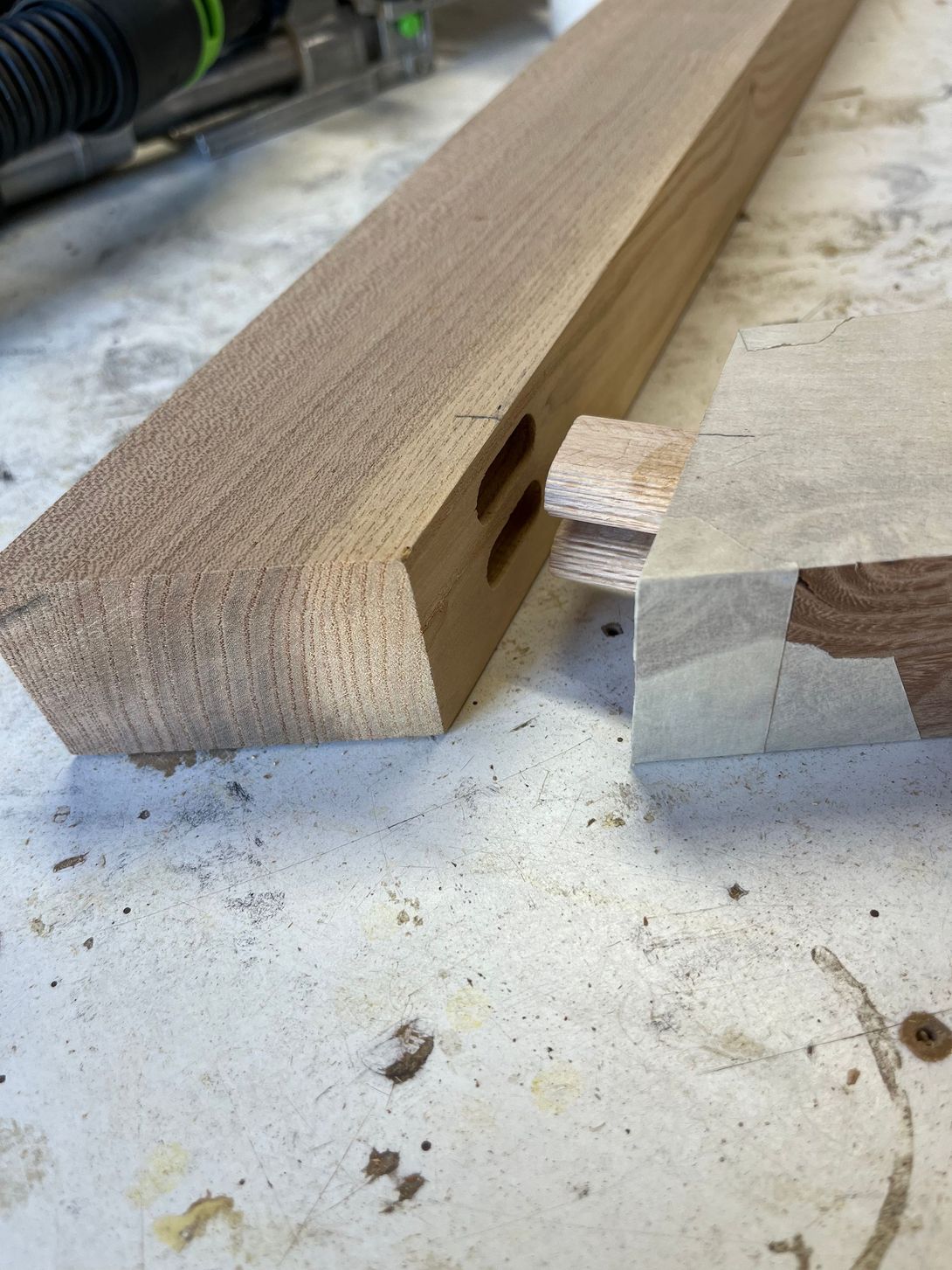 Wooden woodworking project, mortise and tenon joint construction in progress.