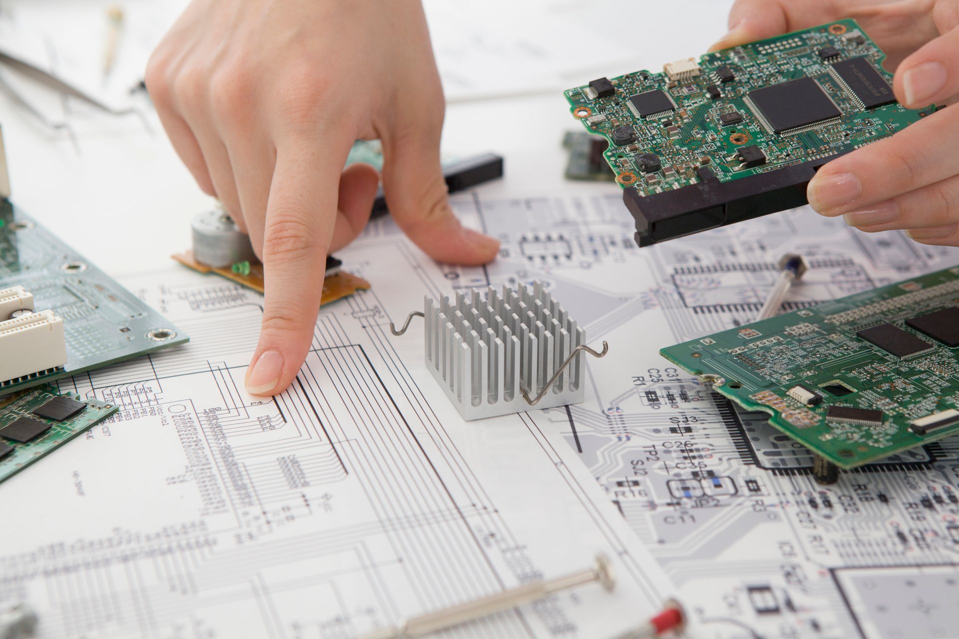 schematic design and populated electronic circuit board