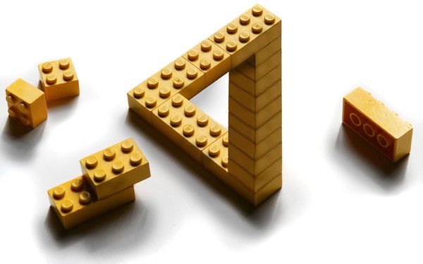 Yellow Lego bricks in a triangle