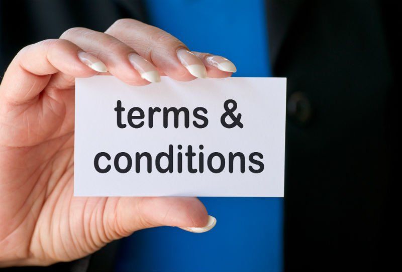 lady hand and holding a terms & Conditions card