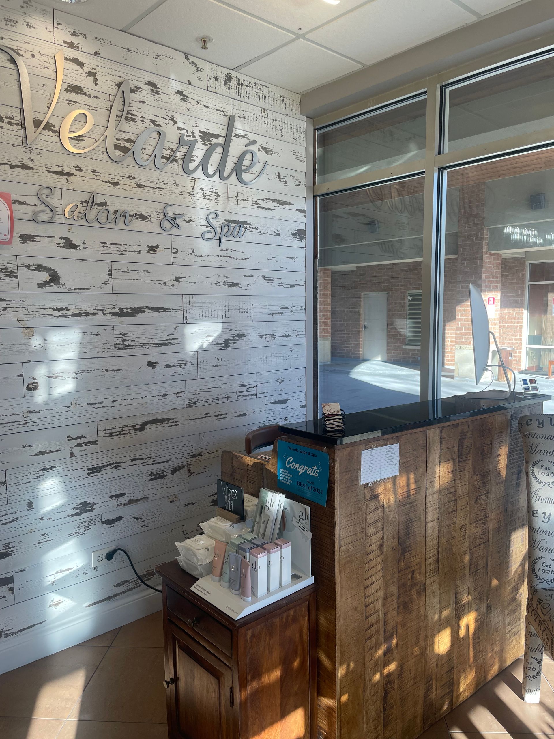 A room with a wooden counter and a large window.