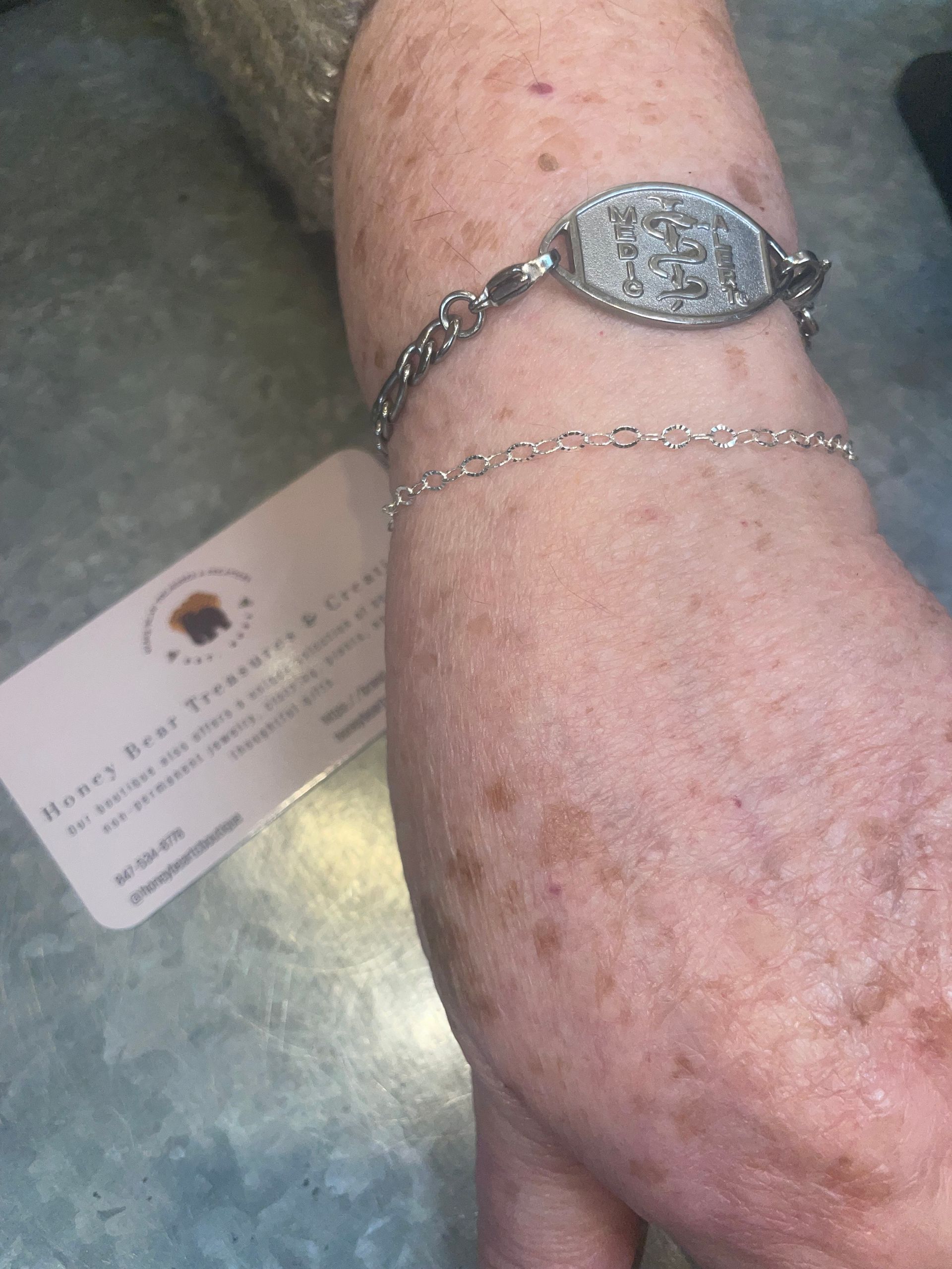 A person is wearing a bracelet on their wrist.