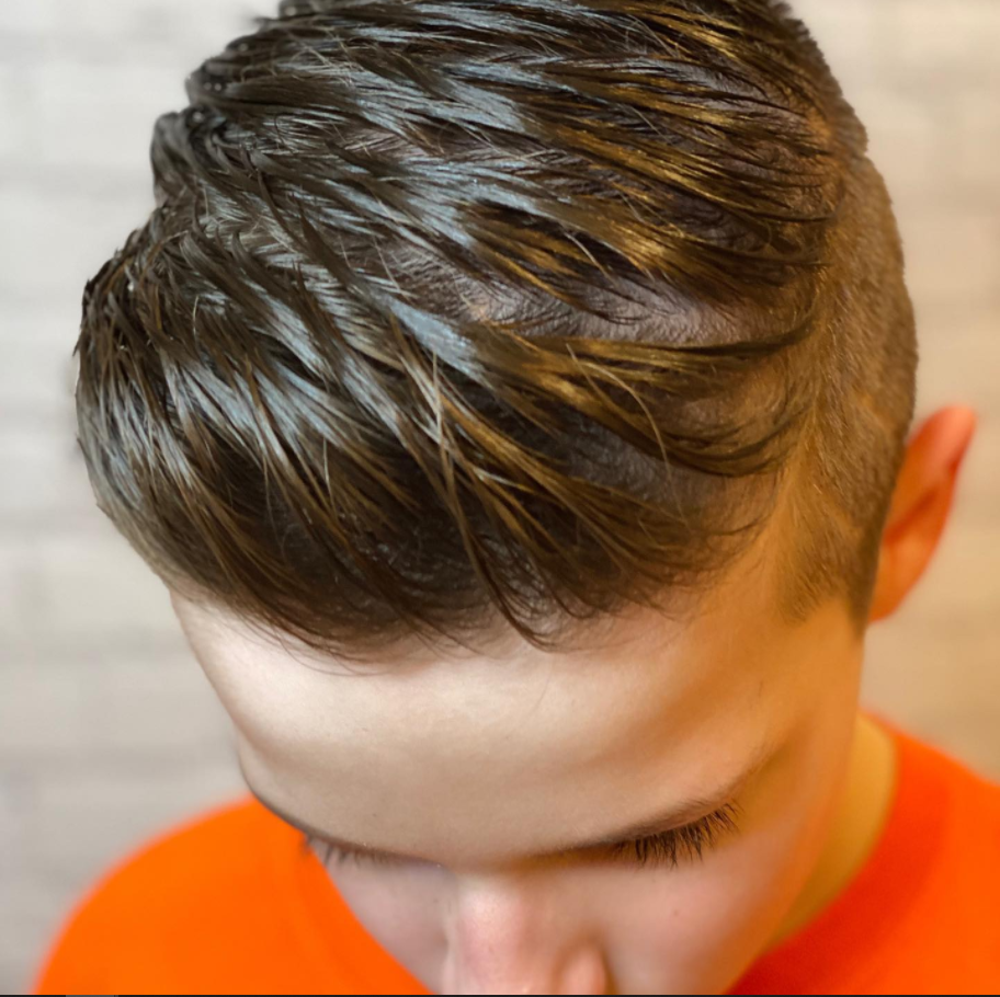 Nail Artist Applying Dark Polish | Roselle, IL | Velarde Salon & Spa