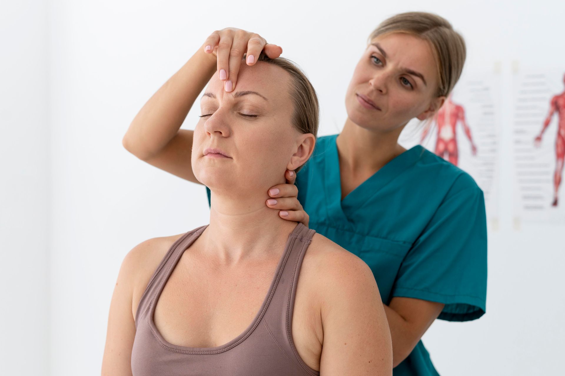 a woman is getting a neck massage from a nurse .