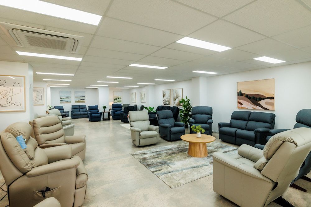 A Living Room Filled With Furniture and a Table — The Comfort Zone Darwin In Winnellie, NT