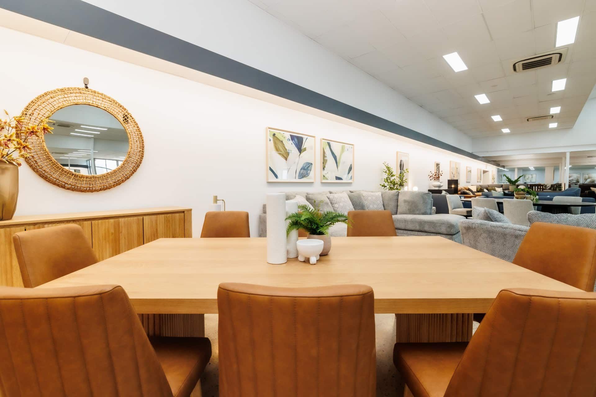 A Dining Room Table and Chairs in a Store 