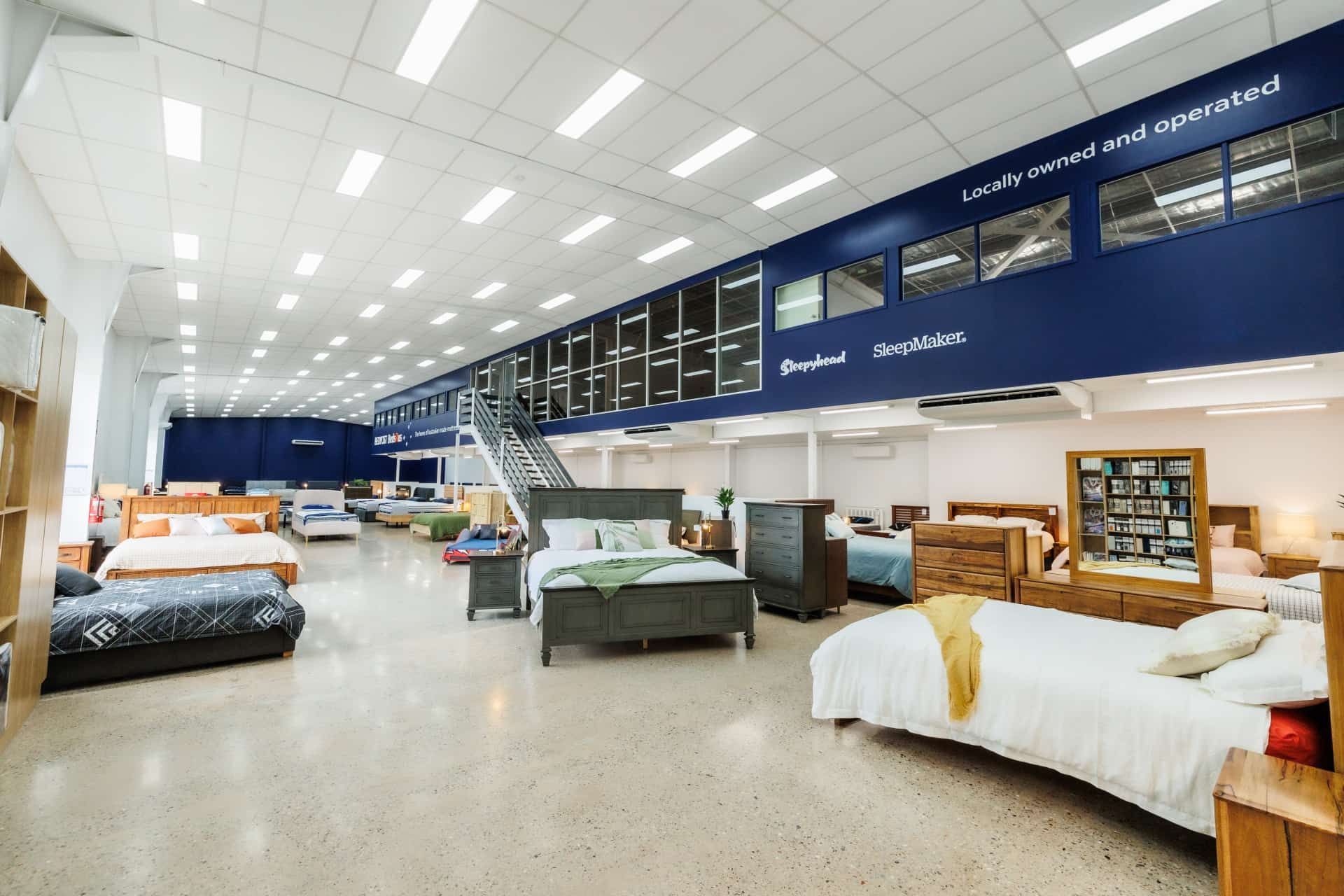 A Large Room Filled With Lots of Bedroom Furnitures — The Comfort Zone Darwin In Winnellie, NT