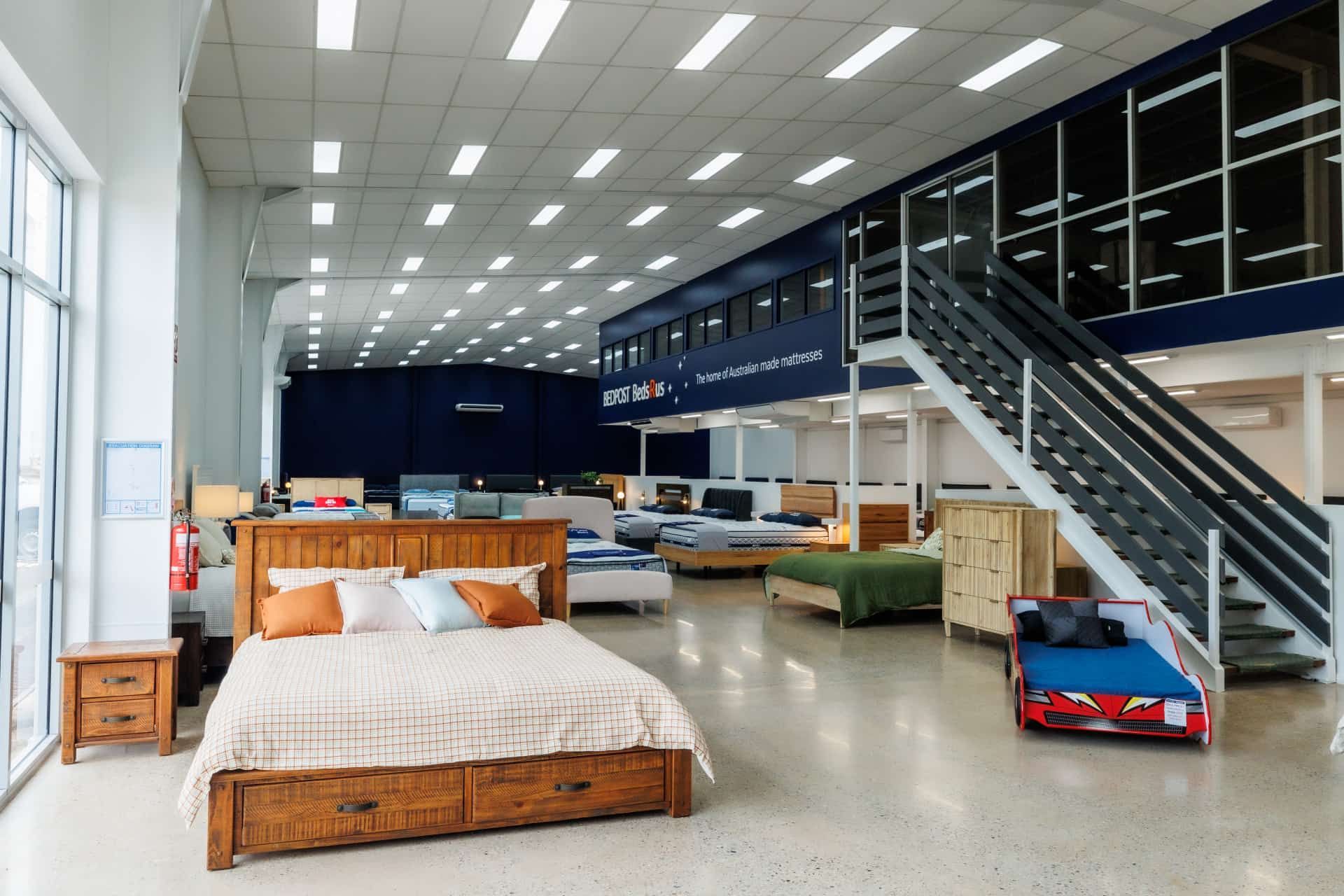 A Large Mattress Store With a Staircase Leading Up to the Second Floor — The Comfort Zone Darwin In Winnellie, NT