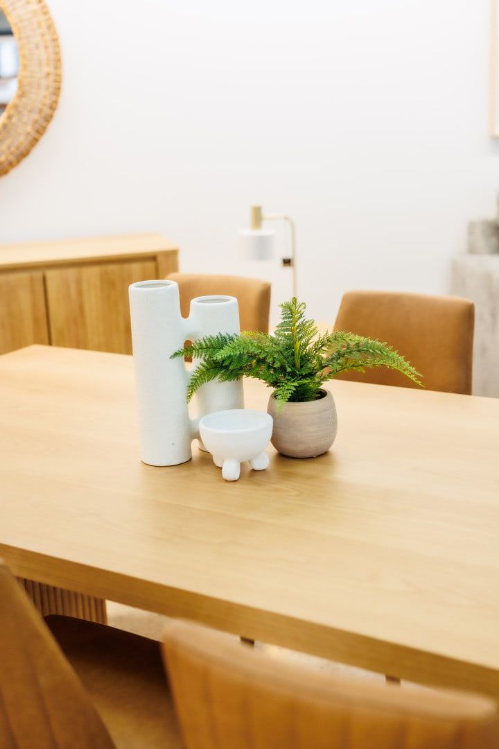 A Wooden Table With Vases and a Plant on It — The Comfort Zone Darwin In Winnellie, NT