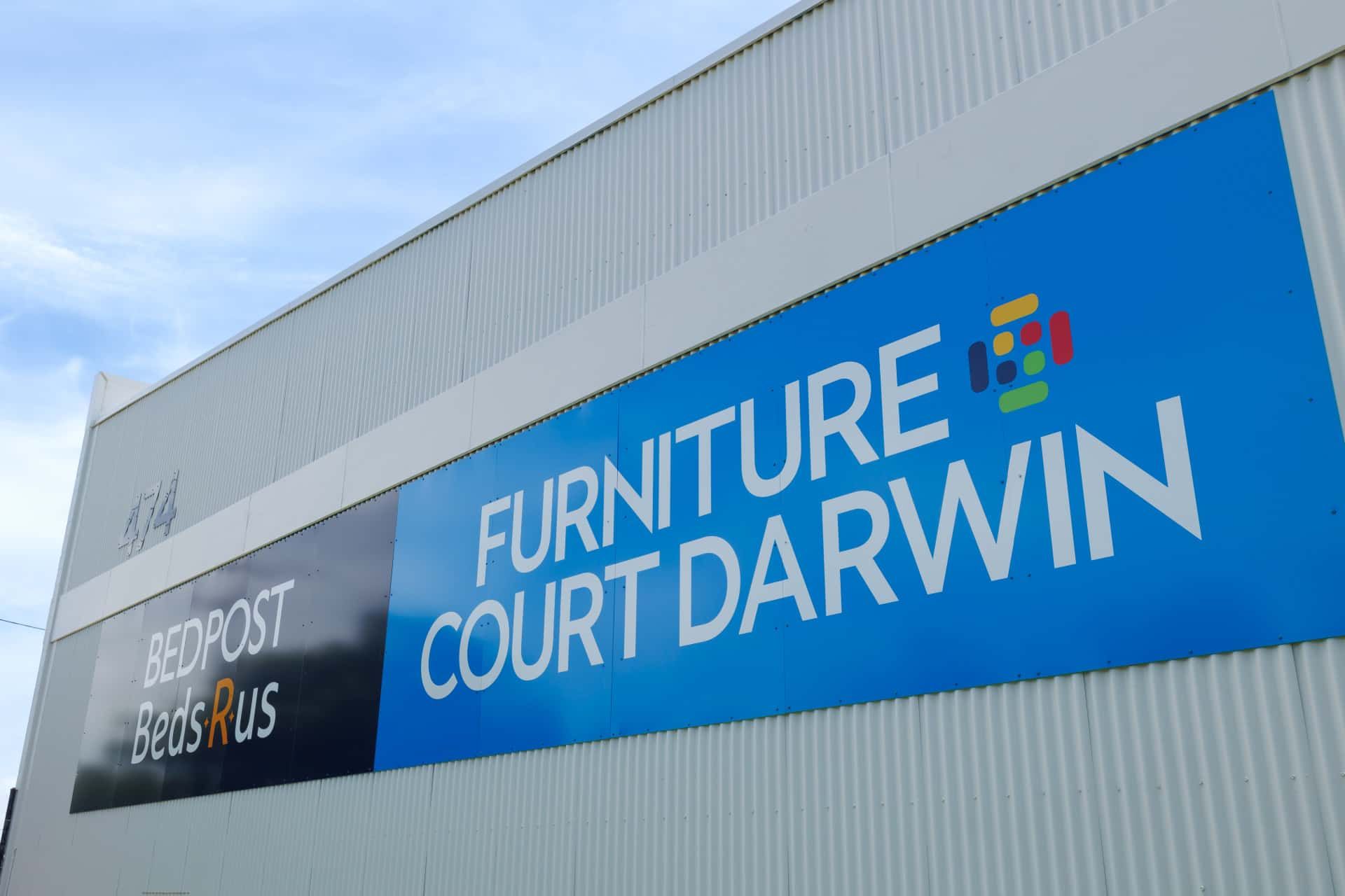 A Large Blue Sign on the Side of a Building — The Comfort Zone Darwin In Winnellie, NT