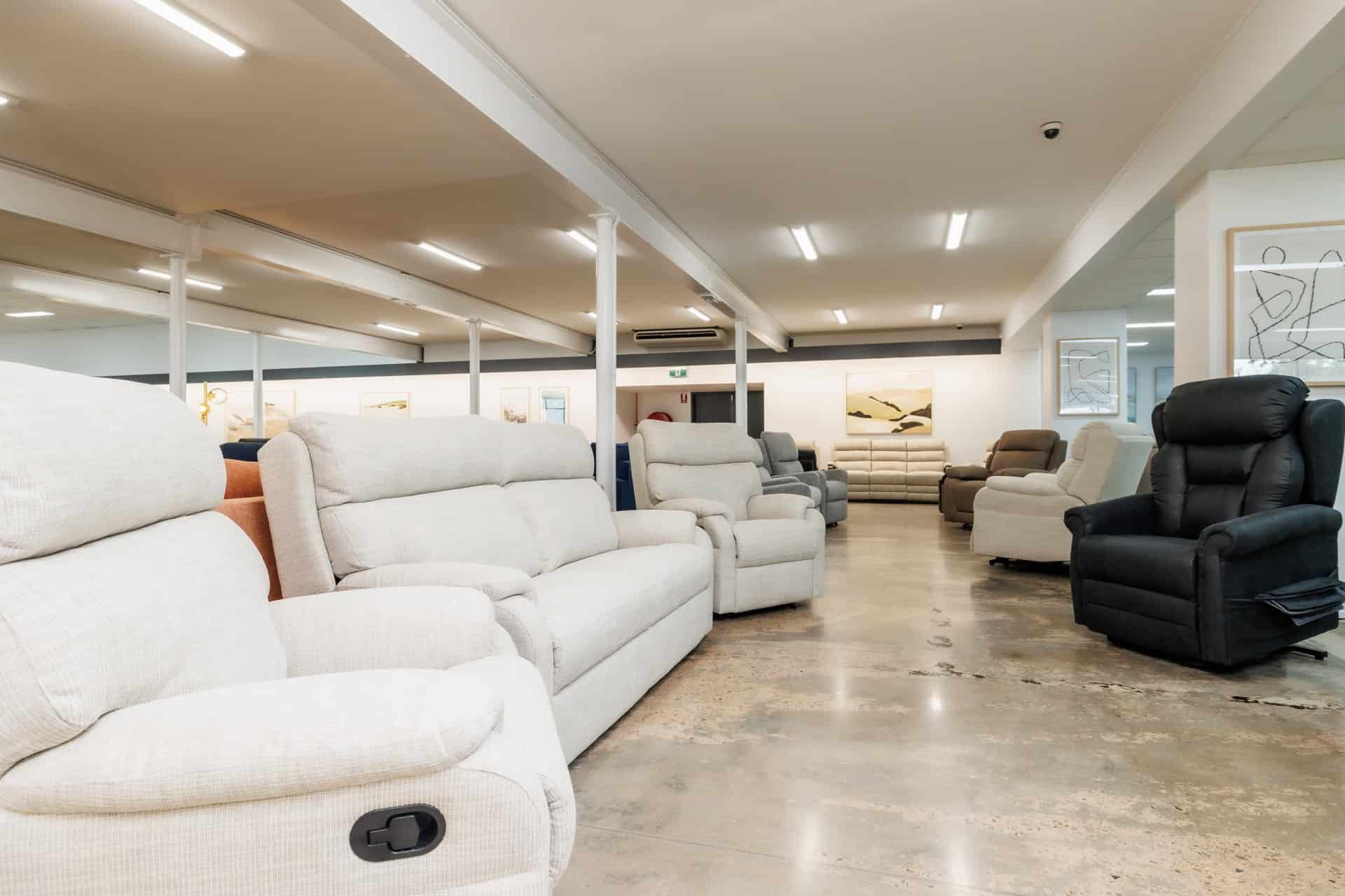 A Large Room Filled With Furniture Including a Couch and Chairs — The Comfort Zone Darwin In Winnellie, NT