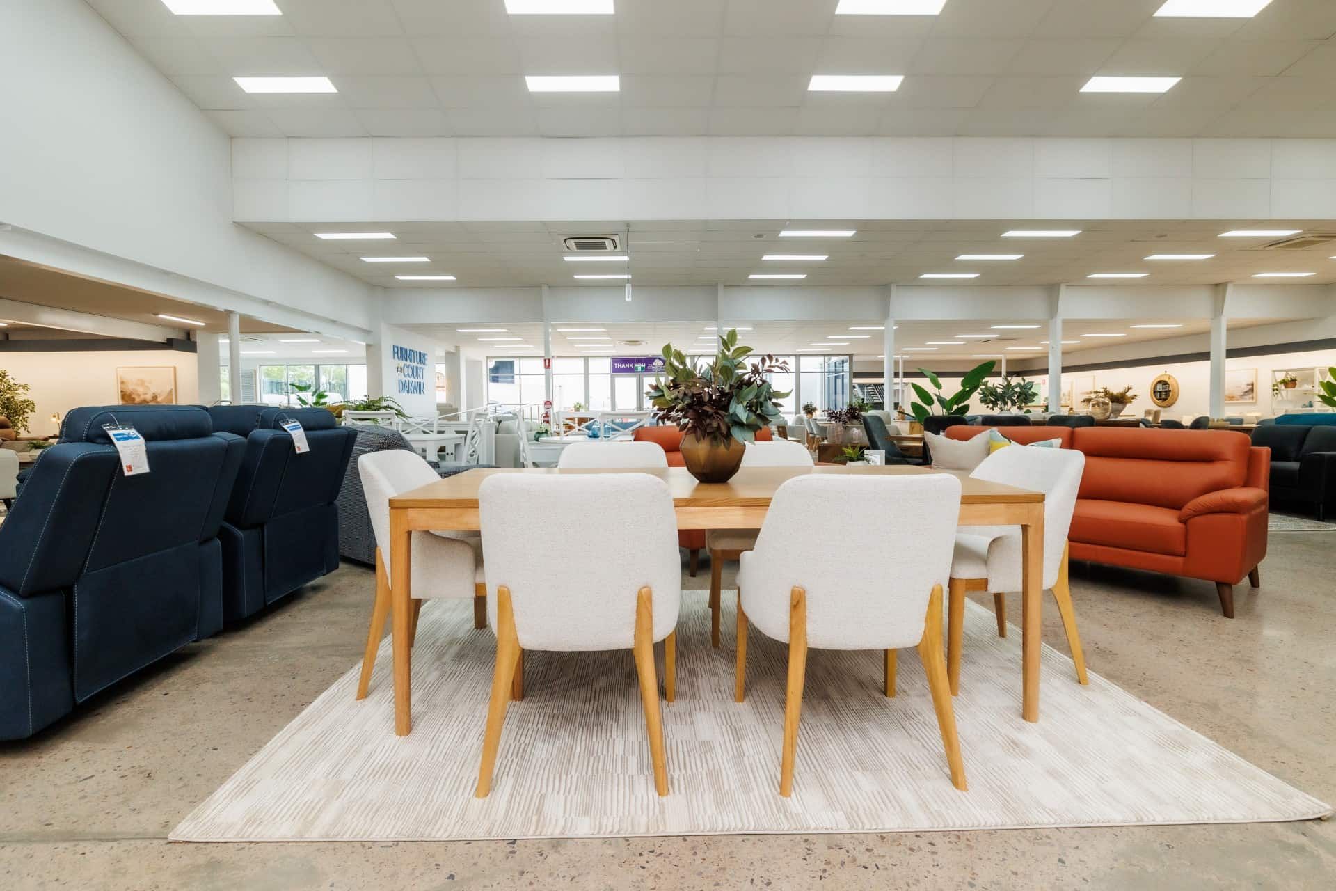 A Dining Room Table and Chairs in a Furniture Store — The Comfort Zone Darwin In Winnellie, NT